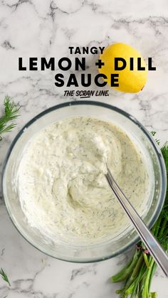 a glass bowl filled with lemon dill sauce