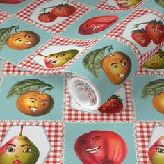 an image of apples and pears on a checkered tablecloth