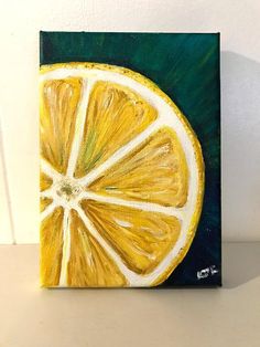 a painting of a lemon slice on a white surface