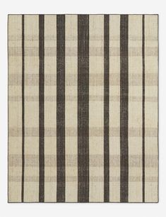 a rug with black and white stripes on the side, in front of a white background