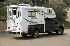 a truck with a camper attached to it