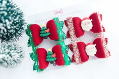 Christmas Inspired Pigtail Set Hair clips are ribbon lined alligator clips All  bows are 100% handmade! I design, die cut and assemble all bows from start to finish.  Designs and color combinations are created by me with the greatest attention to detail. Be sure to contact me with any questions or custom requests, Please continue to check out other items in our shop. Thanks for looking! Prefieres espanol? No hay problema! Please follow us on Facebook and Instagram @Sweetlittlelovebowtique Thank you for visiting Sweet Little Love Bowtique, and we hope you find something special for your little princess! Toddler Pigtails, Woman Costumes, Christmas Hair Bows, Christmas Hair, Alligator Clips, Handmade Gift Wrap, Little Princess, Costumes For Women, Barrettes