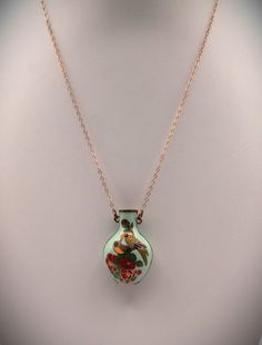 "This is a vintage whimsical little vase necklace. Who would think someone would have a little vase around their neck - on a gold chain! It made me smile so I bought it ( didn't know it was real gold at that time...) Only the chain is 14K. The little vase is cloisonné enamel with 2 parrot like birds & flowers. The vase does have some wear issues, the most noticeable to me I marked in pic 3. As I looked at the comparable necklaces, it appears that most have the same types of wear issues. The chain is approximately 12\"L. The vase is 1.25\"L x .75\"W. The last pic shows the 14K. Thanks for looking in the shop! Don't forget - 20% off!" Vase Necklace, Vintage Whimsical, Dope Jewelry, Classy Jewelry, Cloisonne Enamel, Real Gold, Vintage Necklace, Gold Pendant, Gold Chain