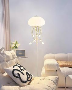 a living room filled with furniture and a lamp