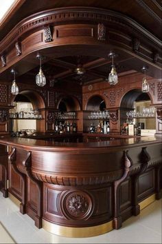 a large wooden bar with lots of stools