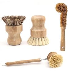 three different types of shaving brushes on a white background, one with a wooden handle