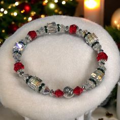 Create your own Christmas Sparkle Bracelet with Too Cute Beads easy-to-make Christmas Jewelry making kits. This bracelet was designed using a combination of Swarovski Crystals paired with rondells, and sterling silver beads and findings. . Our jewelry kits include materials to create one finished bracelet and printed instructions. Completed Size: Up to 8 inches Materials: Swarovski Bicones Swarovski Cubes Swarovski Rounds Sterling Silver Bead Caps Sterling Silver Multi-cut saucers Emerald Rondel Christmas Jewelry Diy Bracelets, Christmas Beaded Jewelry, Christmas Jewelry Diy, Cute Beads, Christmas Sparkle, Swarovski Pendant, Sparkle Bracelet, Earring Kit, Bracelet Kit