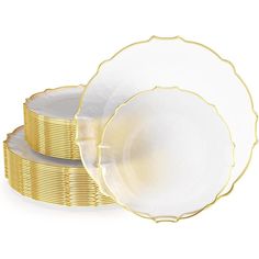 gold and white plates stacked on top of each other