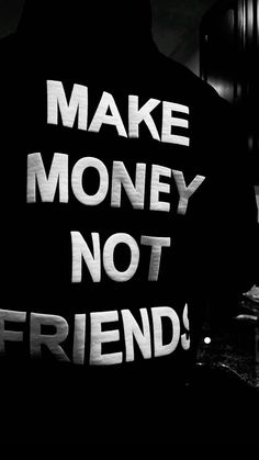 black and white photograph of a man with the words make money not friends written on his jacket