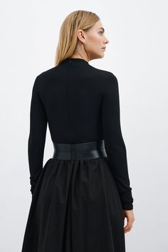 Our Ophelia Belt is a match made for all the garments in your closet. Handcrafted from luxe Italian leather, geometric seam details sculpt the form of the belt and add shape to the waistline. Ophelia's contrast zipper front-and-center makes for eye-catching edge, while an understated elastic panel at the back provides a comfortable stretch fit. Add Ophelia to your dresses, jumpsuits, tunics and beyond...you'll find so many ways to style her. | Maritza Large Belt Outfit, Black Fitted Belt For Night Out, Chic Fitted Leather Corset Belt, Luxury Corset Belt, Luxury Fitted Corset Belt, Chic Black Belts, Modern Fitted Corset Belt For Party, Elegant Leather Corset Belt For Fall, Chic Fitted Corset Belt With Belt Loops