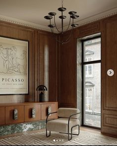 a room with wood paneling and a chandelier