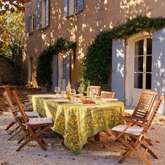 a table set up outside in front of a house