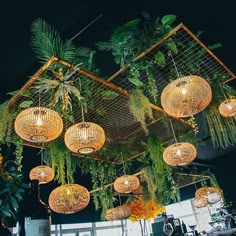 an image of a restaurant setting with lights hanging from the ceiling and decorations on the tables