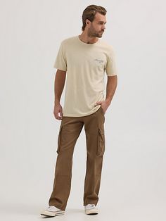 You can take everything with you whenever you wear our Men’s Ripstop Cargo Pant. Made to handle everything the day throws your way, these relaxed fit pants are as tough as they come. They’re crafted from a woven cotton fabric with just a hint of stretch. They feature a straight leg, roomy side pockets with extra compartments for essentials, back pockets, side pockets, a keychain belt loop, as well as a classic zip-fly and button closure. They won’t disappoint. Men Cargo Pants Outfit, Relaxed Fit Pants, Wrangler Pants, Gay Outfit, Cargo Pants Outfit, Men's Apparel, Cargo Pant, Men Fits, Cargo Pants Men