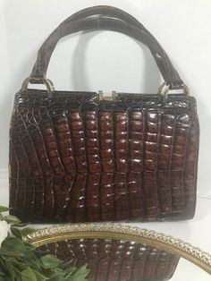 "Vintage 1960s brown croc embossed leather handbag purse, Jackie O style vintage purse, Vintage croc alligator embossed Mod leather handbag.  This handbag does show wear, please see photos. Height 8.25\" Width 11\" Depth 3\" Strap 15\""