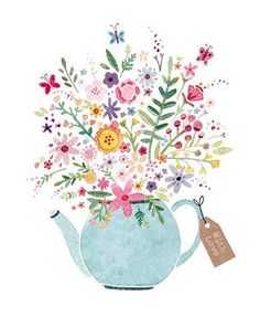 a blue teapot filled with lots of flowers