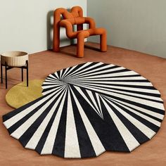 a black and white rug on the floor in a room with two chairs, a table and a chair