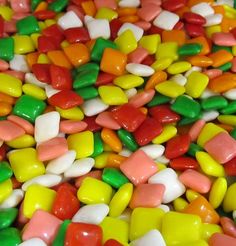 many different colored candies are scattered together