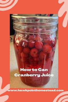 a jar filled with cranberry juice on top of a table