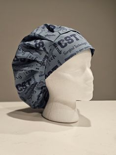 a white mannequin head wearing a blue bandana