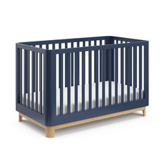 a blue crib with white sheets on the bottom and sides, in front of a white background