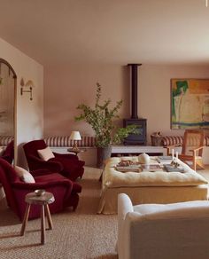 a living room filled with furniture and a fire place