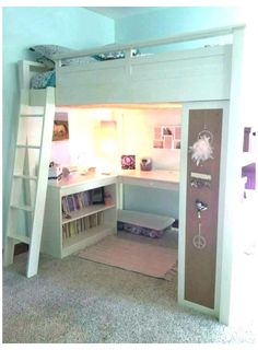 there is a loft bed with a desk and bookshelf in the room,