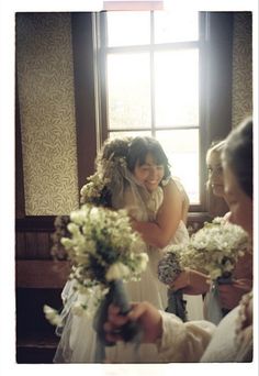 the bride and her maid are getting ready to walk down the aisle