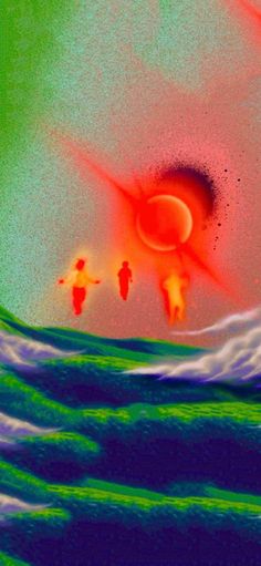 two people are walking in the water near an orange sun