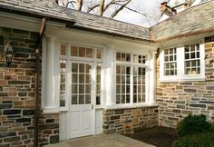 a house with two white doors and windows