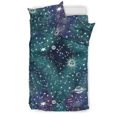 a bed with stars and planets in the night sky, on top of a white pillow