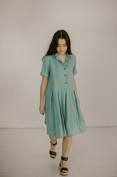 "Eva - below the knee button front linen dress with pockets and short sleeves Qualities of this flowy pleated skirt dress: - made from Oeko-Tex certified 100 % European linen fabric which guarantees you that it meets human - ecological requirements. The linen fabric is of medium weight (185 g). - if your feel that you need to add extra length - do not hesitate to contact us. - in the pictures, you can see a Mint green plus size linen bridesmaid dress. Please choose any other color on the right. Flowy A-line Pleated Dress For Summer, Summer Dress With Pleated Hem For Day Out, Summer Day-out Dress With Pleated Hem, Short Sleeve Summer Dresses With Buttons, Summer Flowy A-line Pleated Dress, Summer Dresses With Buttons And Short Sleeves, Summer A-line Flowy Pleated Dress, Knee-length Relaxed Fit Shirt Dress For Summer, Relaxed Fit Knee-length Shirt Dress For Summer