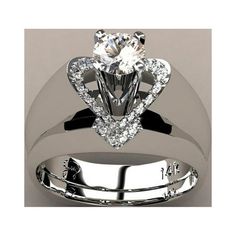 a white gold ring with a heart shaped diamond