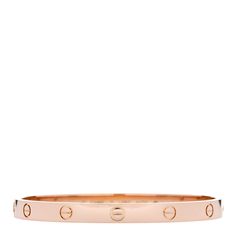 This is an authentic CARTIER 18K Pink Gold LOVE Bracelet size 19. The bracelet is crafted of 18 karat pink gold and features the signature engraved LOVE screw motifs throughout the bangle. The bracelet also features the Cartier screw system that prevents the loss of the screws when opening the bangle. Gold Love Bracelet, Love Bracelet, Love Bracelets, Bracelet Sizes, Pink Gold, Cartier, Pink And Gold, Screw, Bangles