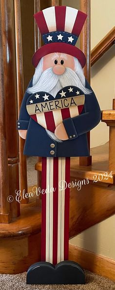 a patriotic santa clause standing on top of a wooden stair case next to a banister