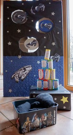 an open suitcase sitting on top of a tiled floor next to a star trek poster