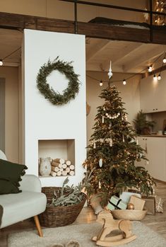 a living room with a christmas tree in the corner