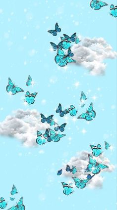 there are many blue butterflies flying in the sky with white clouds and snow flakes