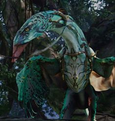 an image of a creature in the forest with wings and claws on it's back