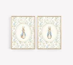 two framed pictures with rabbits on them, one is blue and the other is white