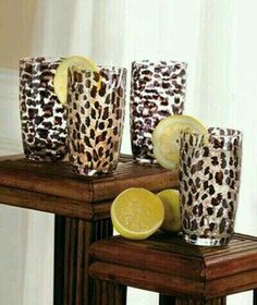 four leopard print cups with lemons on the side