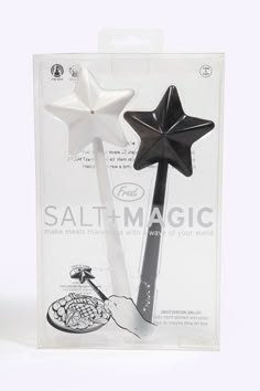 two black and white star shaped toothbrushes in the packaging for each other's use