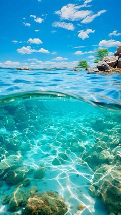 the water is crystal blue and clear with rocks in it's foregrounds