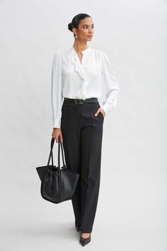 Meet the pant of the season! Our wide leg Fluid Crepe Pant features a high-rise waist, pintuck details and side zip closure. We love these pants worn with its matching double-breasted blazer or with luxe silk satin or knits.   Elie Tahari Exclusive  Wide Leg Pant  71% Polyester, 21% Viscose, 8% Elastane  Runs true to Size  Model is 5'9" and wearing size 2  Measurements: Front Rise: 12"L, Inseam: 33.5'L (approx. length for size 6)  Dry Clean Only  Imported  Style #: E9011204 Jumpsuit Jacket, Long Sleeve Short Dress, Wide Leg Pant, Elie Tahari, Breasted Blazer, Knit Tees, Denim Coat, Knit Jacket, Cardigan Jacket