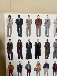 an image of men's suits and ties displayed on a white board in front of a wall