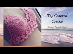 a crocheted bra on the beach with waves coming in from the ocean and an advertisement for top cropped crochet