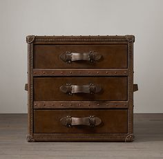 an old trunk is sitting on the floor