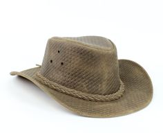 Our weaved leather cowboy hats are made of genuine cowhide leather. This beautifully handcrafted hat is made with fine craftsmanship and materials. Any scars, wrinkles or other subtle variations are characteristics of natural leather and do not affect its strength or quality. The unisex leather hat is embellished with brass conchos. The crown of the had also boasts a braided hat band. Use the strap for windy days or to keep it around your neck while traveling so you won't lose it. Perfect access Cowboy Hat Brown, Black Leather Hat, Brown Leather Hat, Brown Cowboy Hat, Cowboy Hat Bands, Leather Cowboy Hats, Hat Western, Leather Accessories Handmade, Chapeau Cowboy