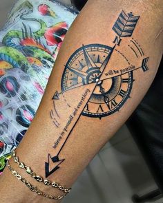 a woman with a tattoo on her arm has a clock and arrows in the middle