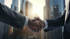 two men shaking hands in front of skyscrapers with the sun shining through their windows